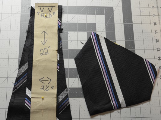 pinning the tie material to the pattern